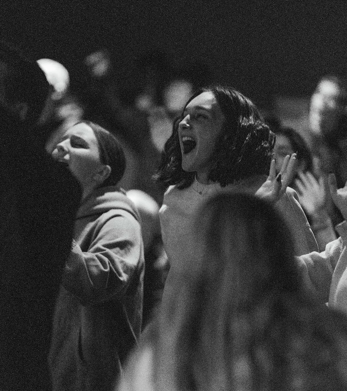 People singing joyfully together during worship