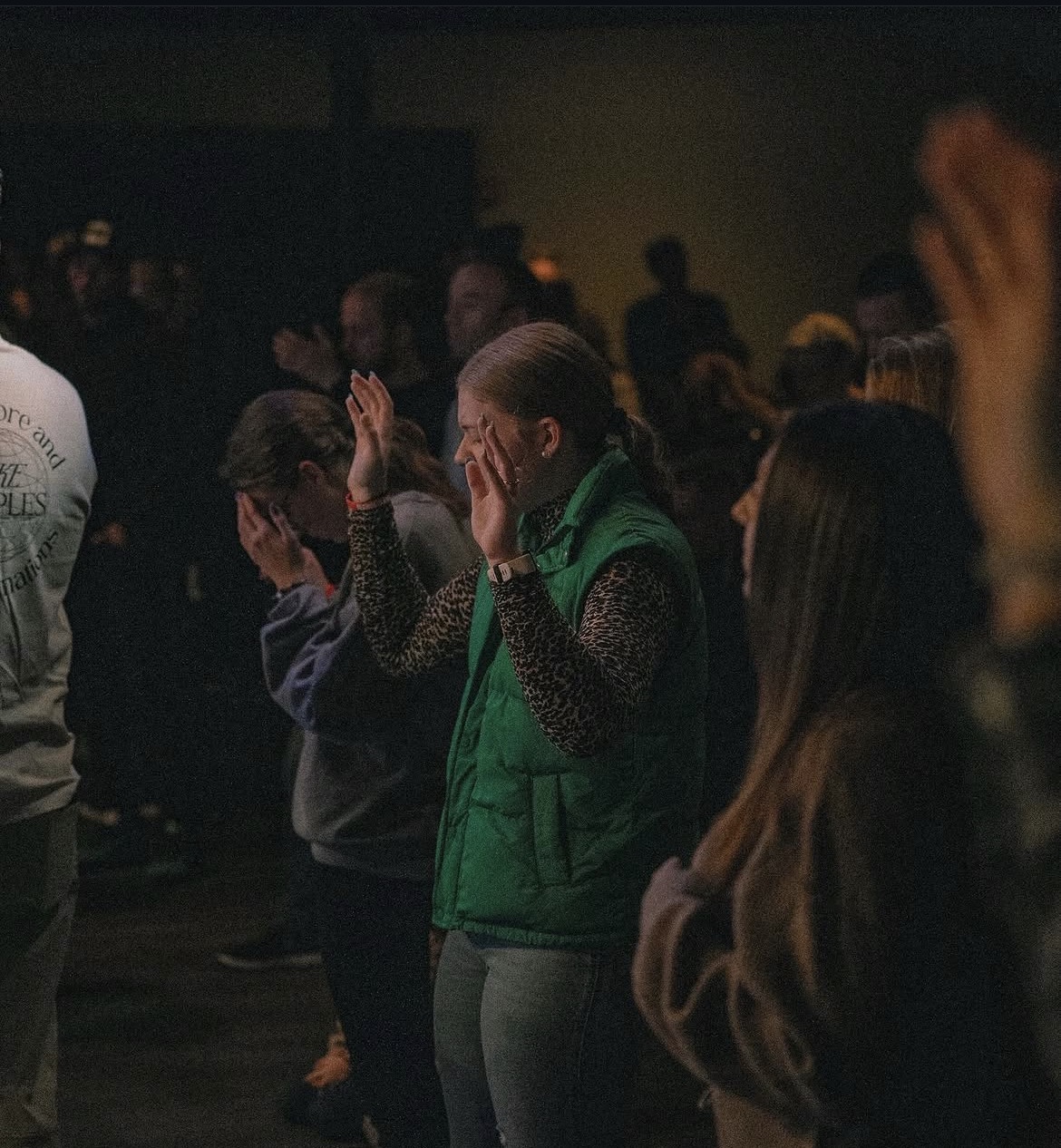 People gathered in a quiet moment of prayer